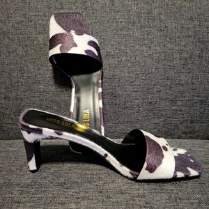 Cow print heel mules